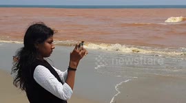 Beach-goers stunned as sea turns RED in southeastern India