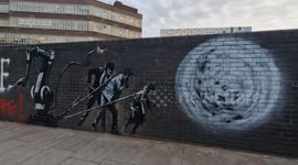 A suspected Banksy artwork in London has new additions telling observers to 'put paint everywhere'
