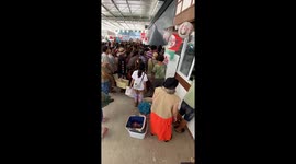 Crazed shoppers run into warehouse selling second-hand goods from Japan