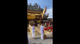 Taoist devotee rams seven swords through his cheek at Phuket Vegetarian Festival