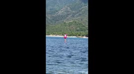 Beachgoer appears to be walking on water in this bizarre optical illusion