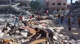 Locals inspect ruins following Israeli airstrike on Rafah