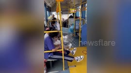 Flood enters bus driving through swamped road in Thailand