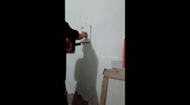 Traditional Chinese Kung Fu practitioner skillfully destroys book with lightning punches