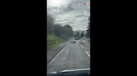 Panic ensues on a Luton road after man spots a Kia on fire