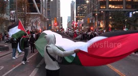 Pro Palestine protesters in Toronto block street out front of Israel consulate to protest the war and hospital bombing in Gaza