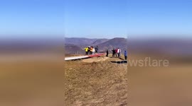 Tourists seen jumping up and down on wind turbine in China