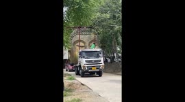 Huge golden Buddha head being transported on lorry holds up traffic