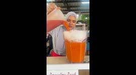Thai cafe serves milk tea in giant glasses