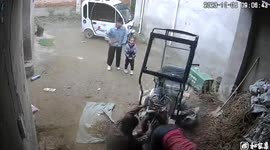 Three-wheeler crashes into mother after girl accidentally launches it in China