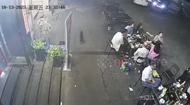 Driver reveres into people eating outside restaurant in China