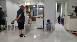 Toddler hilariously imitates the way his grandfather walks
