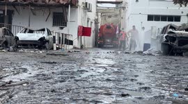 Exclusive footage shows al-Ahli hospital being cleared of debris following deadly blast