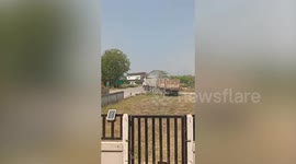 Bungling truck driver destroys fence while trying to turn... then crashes into ditch