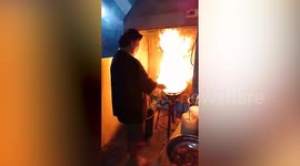 Chef shows off his seriously flame-grilled meat with fiery wok