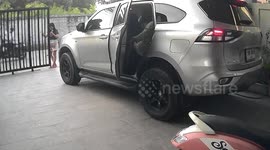 Sliding metal gate topples over as family goes to leave in the morning