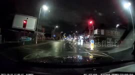 Moment car speeds through T-junction and smashes into building