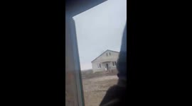 Ukrainian soldiers share a laugh amidst Russian firefight