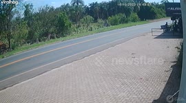 Motorcyclist Wheelies Into Oncoming Truck