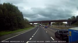 Car leaving it very late to exit the M6 at Junction 19 cutting across a HGV