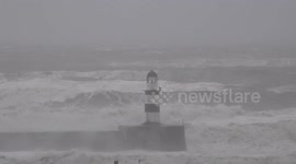 Waves crash into Seaham Harbour as storm Babet hits County Durham, UK