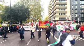London Palestine March on the 21st October with Green Flare Smoke from the crowd at the front of Procession