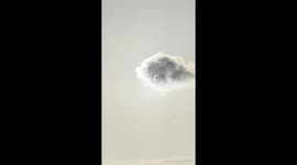 Solar Eclipse Seen Through Cloud
