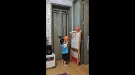 Toddler learning basketball accidentally makes awesome trick shot