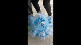 Thai shopper shows space-saving hack, carrying dozens of plastic bottles OUTSIDE a plastic bag