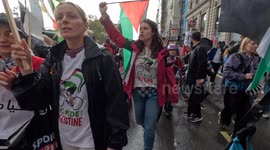 Pro-Palestinian protesters sing to the tune of Bella Ciao as they march in London 21 Oct 2021