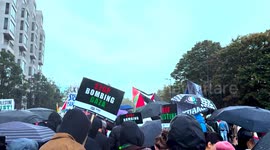 London Palestine March October 21st 2023 Crowd walks in the rain towards Hyde Park Corner
