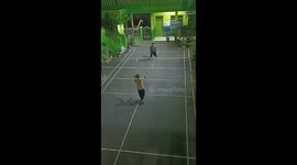 Man accidentally trips and tears tennis net during intense match