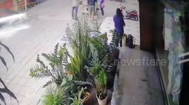Sneaky thief steals woman's bag in broad daylight in Bangkok, Thailand