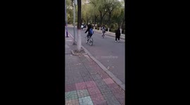 Student rides unicycle through campus in China