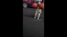 Toddler shows off impressive dribbling skills with TWO basketballs