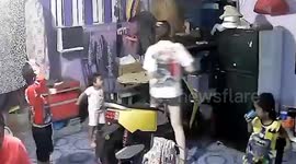 Kid accidentally accelerates motorcycle making mother fall off