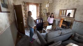 Resident shows water damage to her home following Storm Babet in Brechin, UK