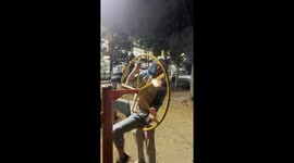 Guys Create Human Wheel of Fire WIth Playground Equipment