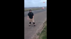 Aberdeen, Scotland: Man cannot move forward due to unreal wind pressure