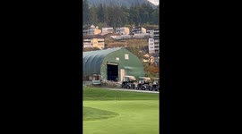 Black bear spotted stealing bin bag full of soda cans from golf club