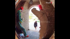 Girl scared of clowns finds two large ones on the doorstep for Halloween