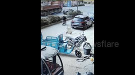 Truck narrowly misses boy suddenly running across road in China
