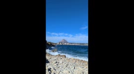 Waves overlapping onto the shore overlooking Javea