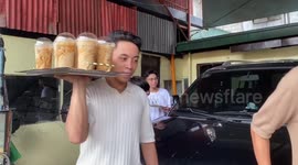 Waiter drops a tray full of milk teas while carrying it to table