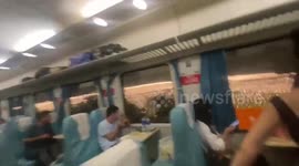 Train passengers marvel at ocean of lights in fields in China