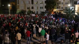 People gather near the Israeli embassy in Amman, Jordan to show support for Gaza