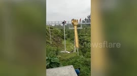 Tourist dies in fall from shattered glass bridge in Indonesia
