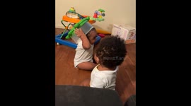 Mischievous boy sticks finger in twin's mouth, gets bite-sized life lesson