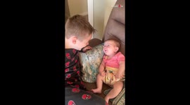 10-week-old baby enthusiastically chats with her 6-year-old cousin