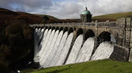 Craig Goch Dam at Elan Valley overflows during an Autumn afternoon, Mid Wales, UK